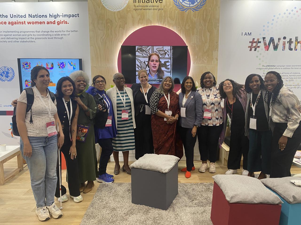 Group of women standing in front of Spotlight display