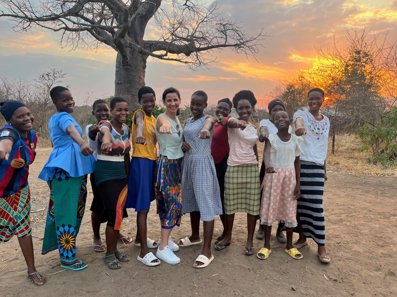 Several women posed in a row smiling
