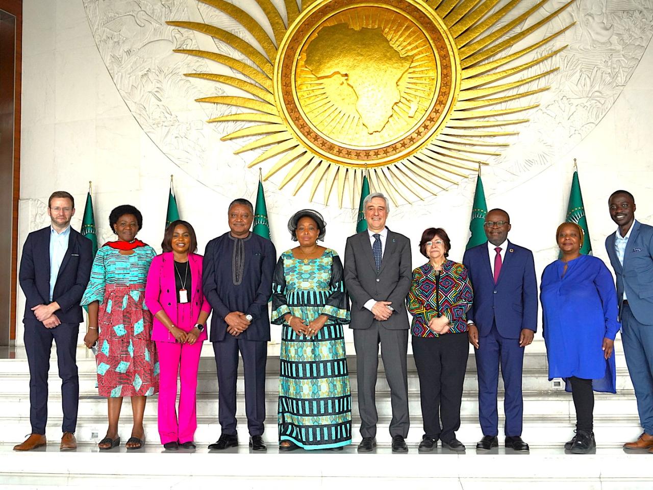 Line of men and women smiling at camera