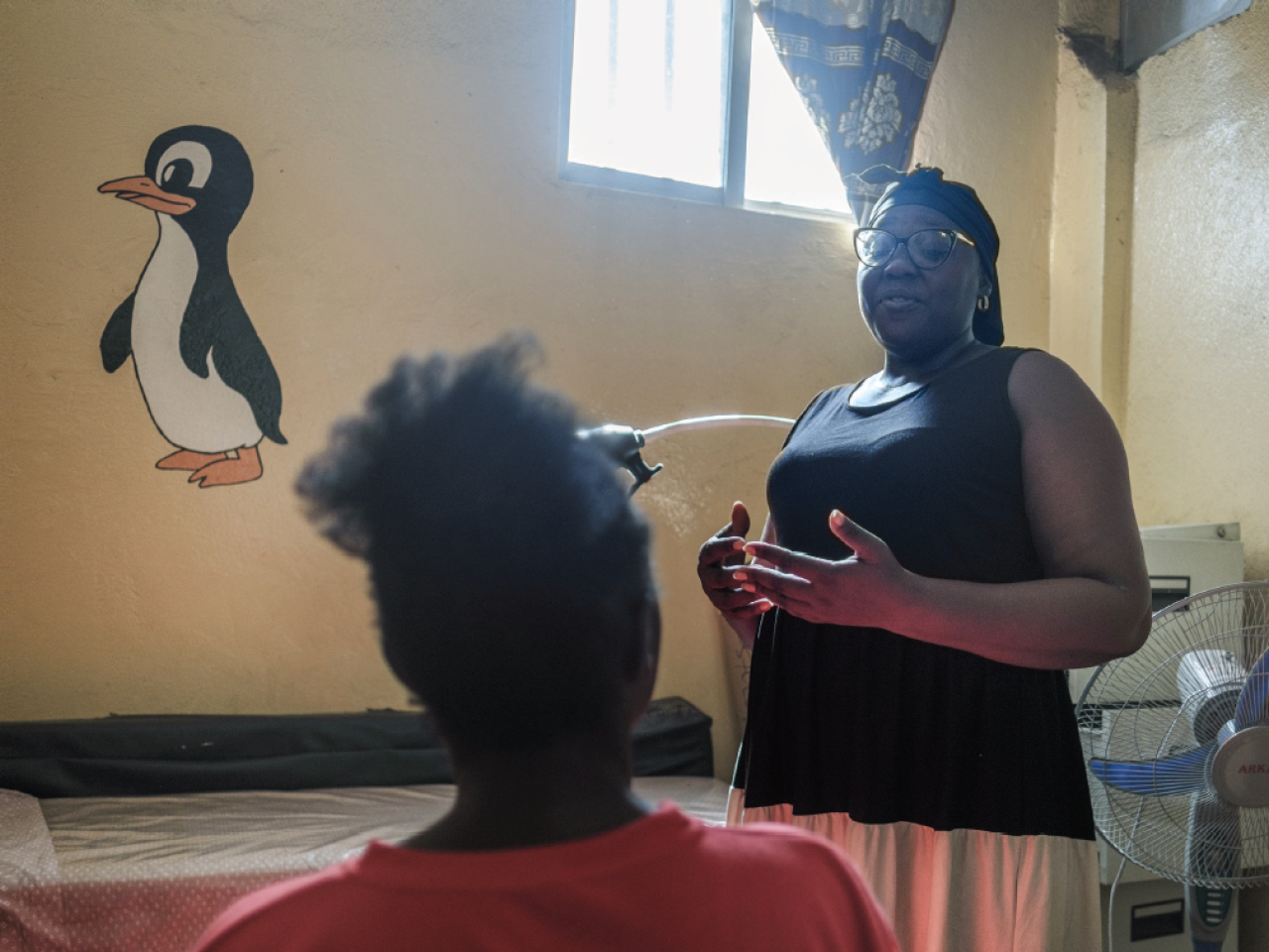 Tow women speaking in an office setting
