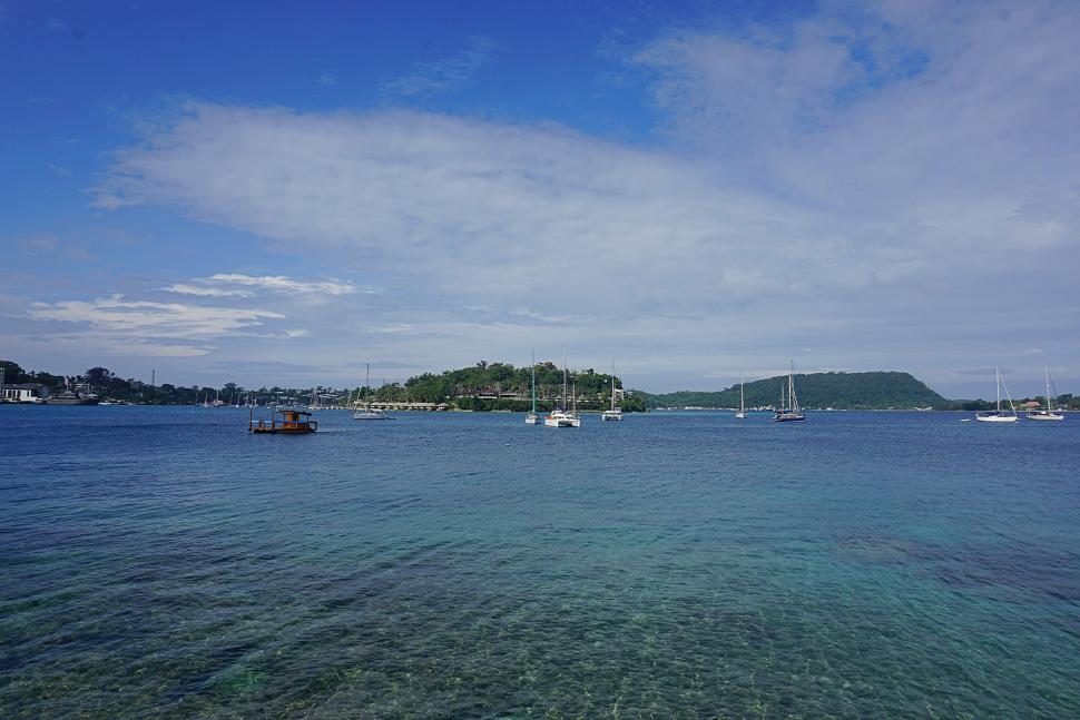 Clear water of the Port Vila Harbour against blue sky.