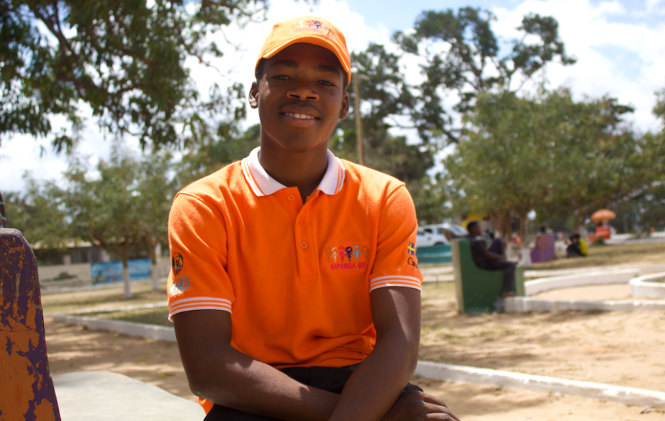 Boy in orange cap and t-shirt