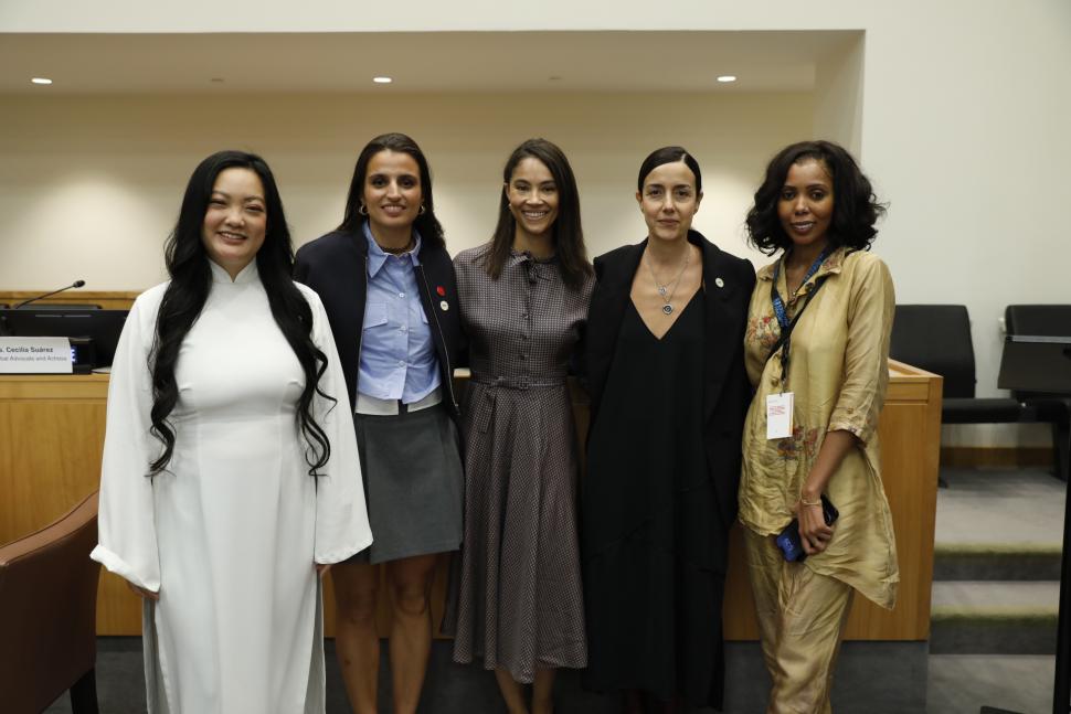 Five women standing together