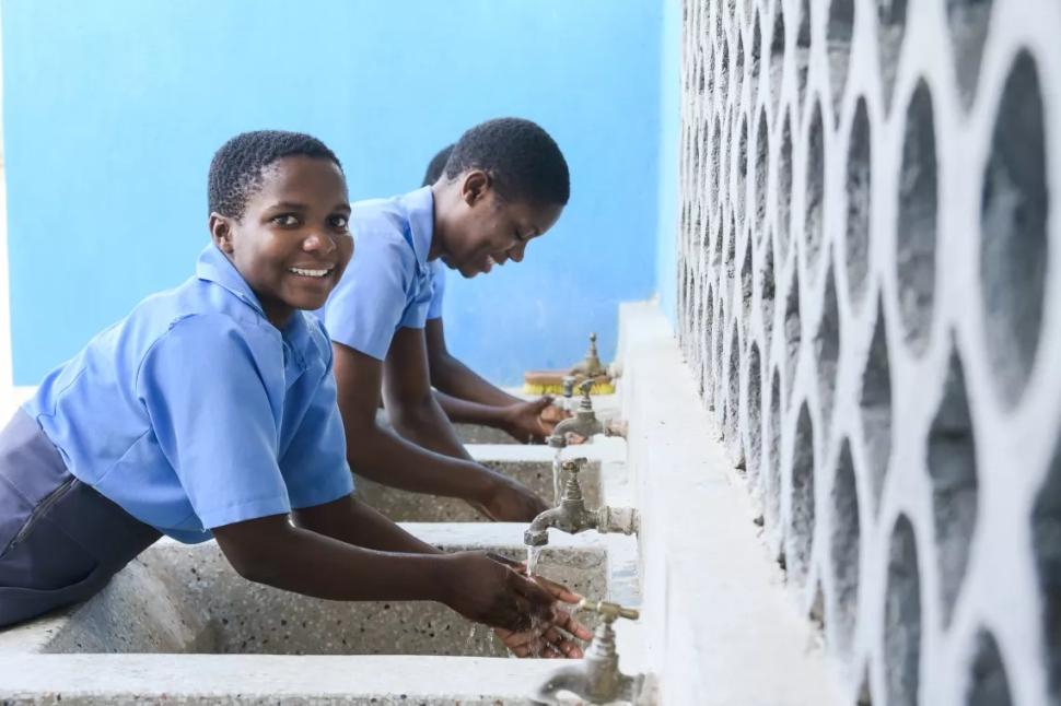 Two girls washing hands