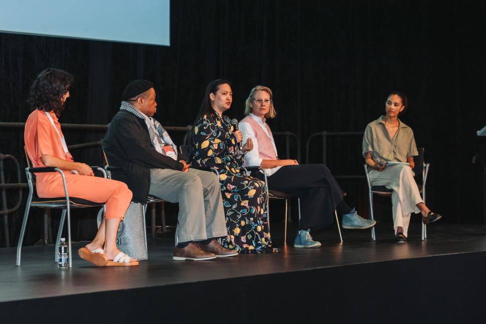 Amanda Nguyen (centre) addresses the audience.