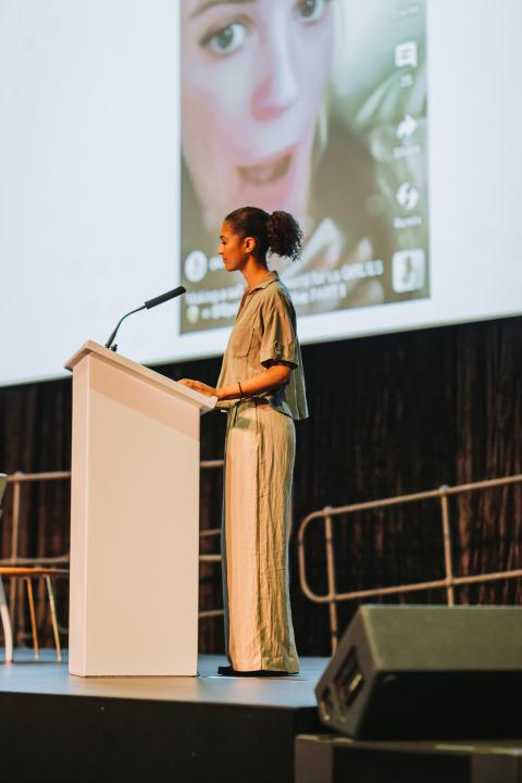 Sinead Bovell speaking at a lectern