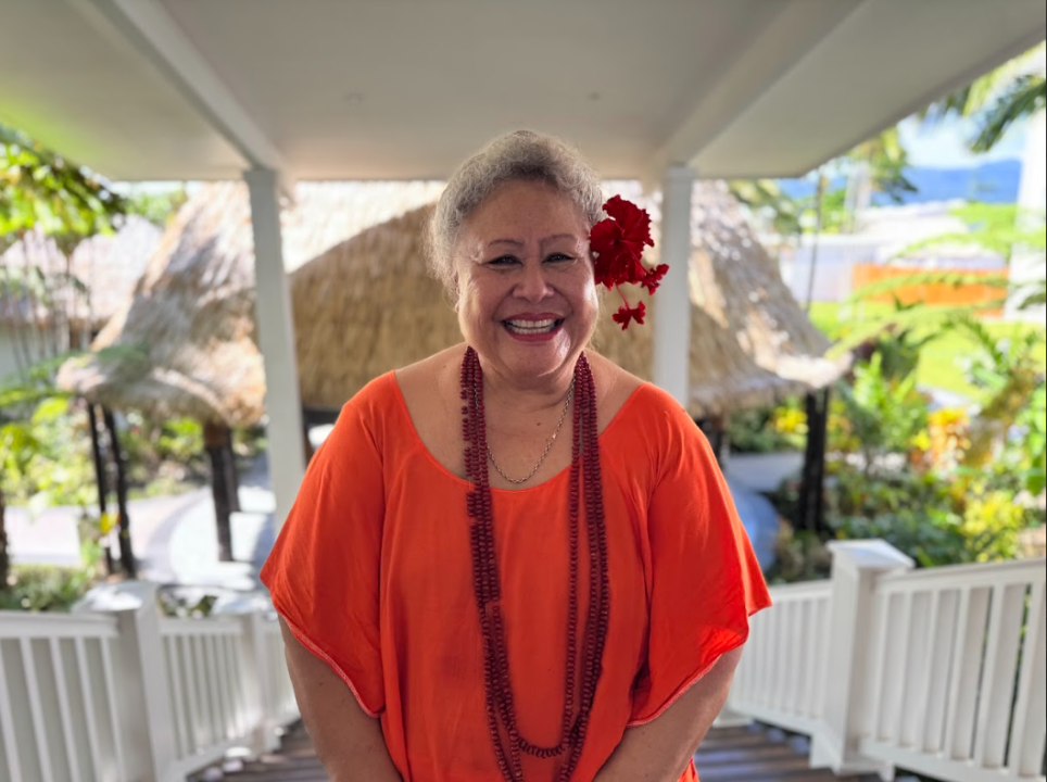 Smiling woman in orange dress