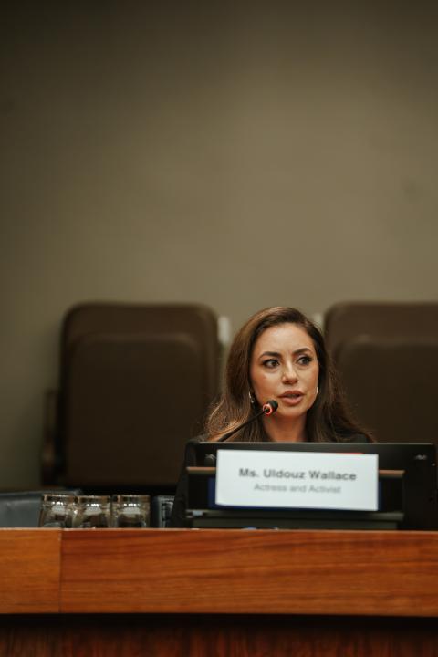 Ms Uldouz speaking into a mic