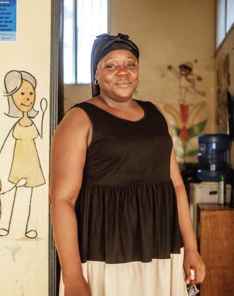 Ms Dongbo smiling outside centre. Photo: UNFPA ESARO