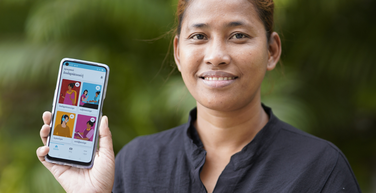 A woman holding a mobile phone