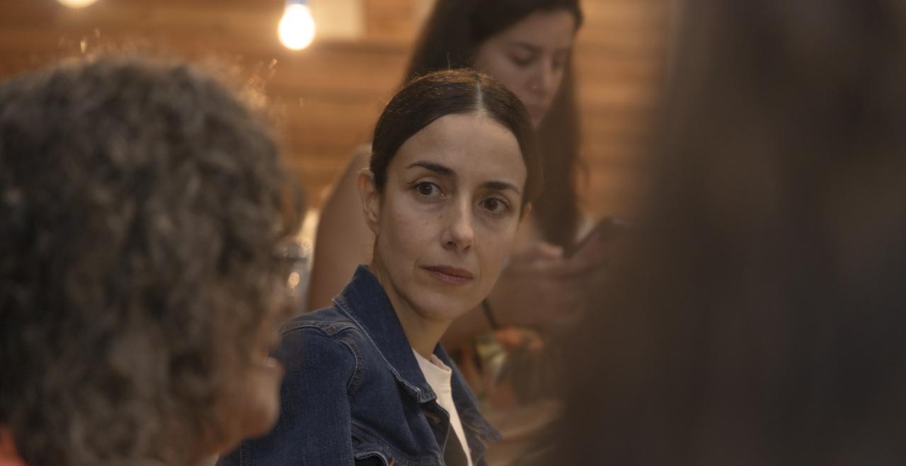 Close up of Cecilia Suarez listening to activist