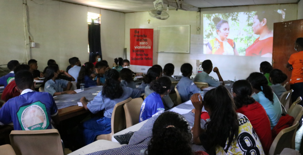 Young people watch a film screening in a class room