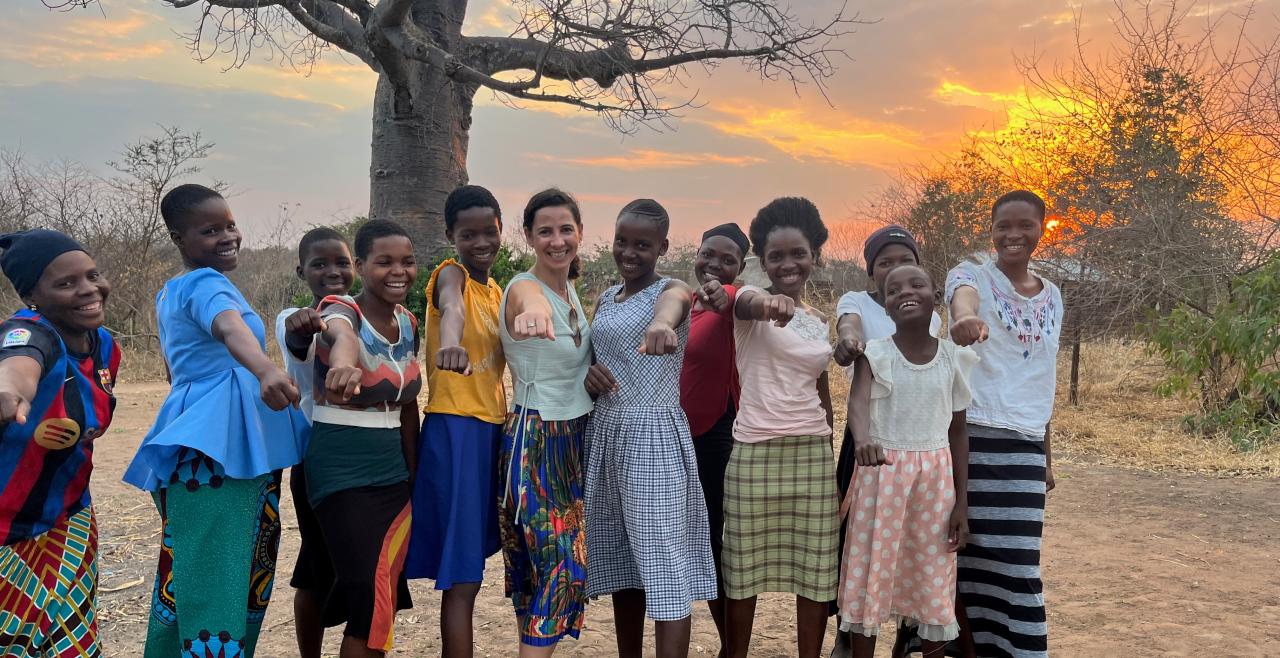 Several women posed in a row smiling