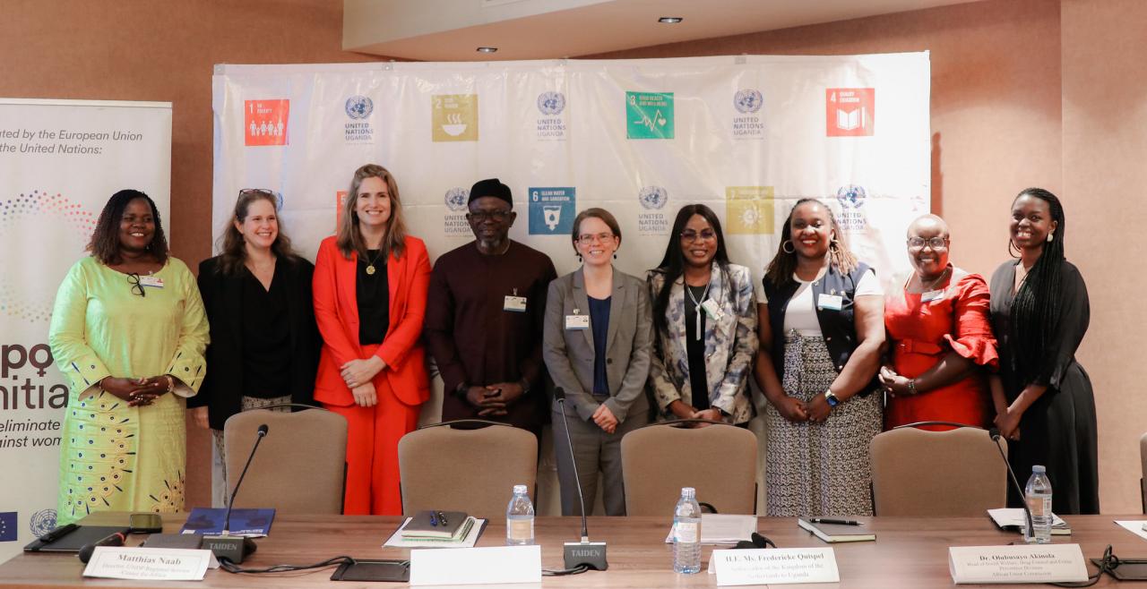 Speakers and panellists standing in a row