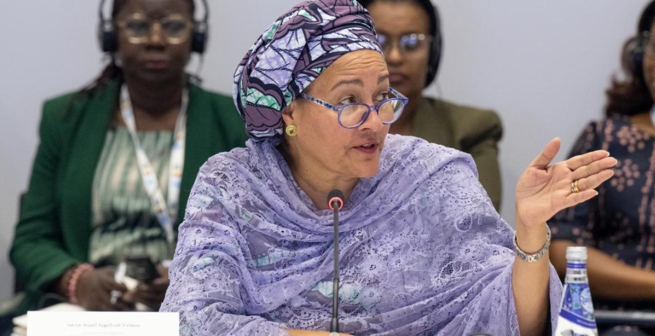 UN Deputy Secretary General Amina Mohammed speaking into a microphone