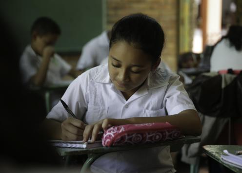 Girl in uniform writing