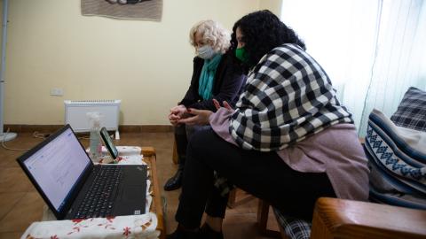 A lawyer and a phycologist at Fundación Espacio de la Mujer provide counseling to women through video calls during COVID-19 lockdowns in the city of Moreno